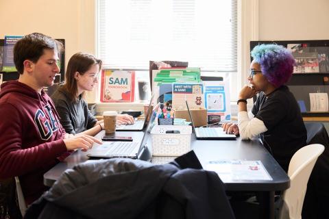 students meeting around a table
