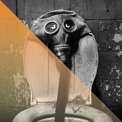 a gas mask sits over a dirty toilet 