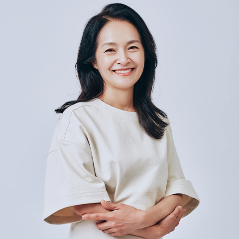 Composer Eun Young Lee poses for the camera and smiles 