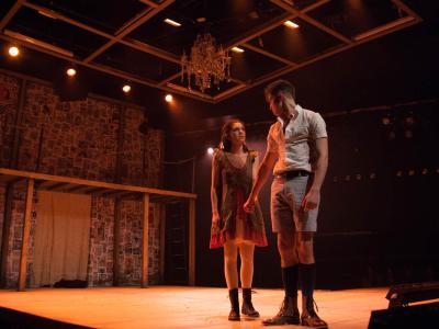 Man and woman on stage acting out a scene