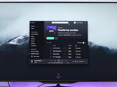 Large computer monitor displaying Spotify app