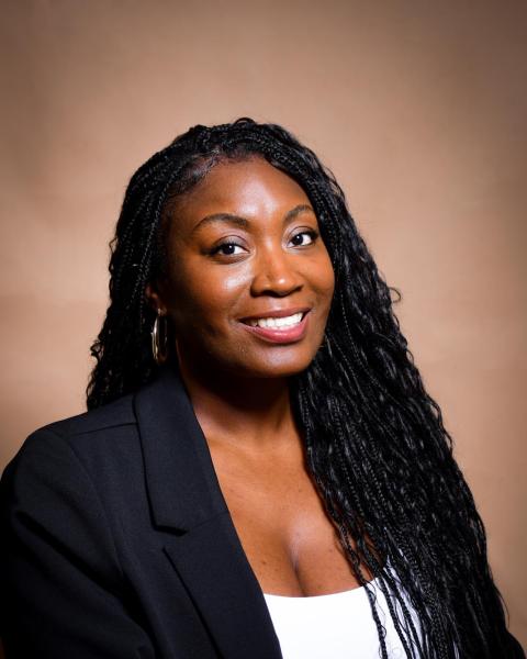 Woman with long Black hair in a top and blazer