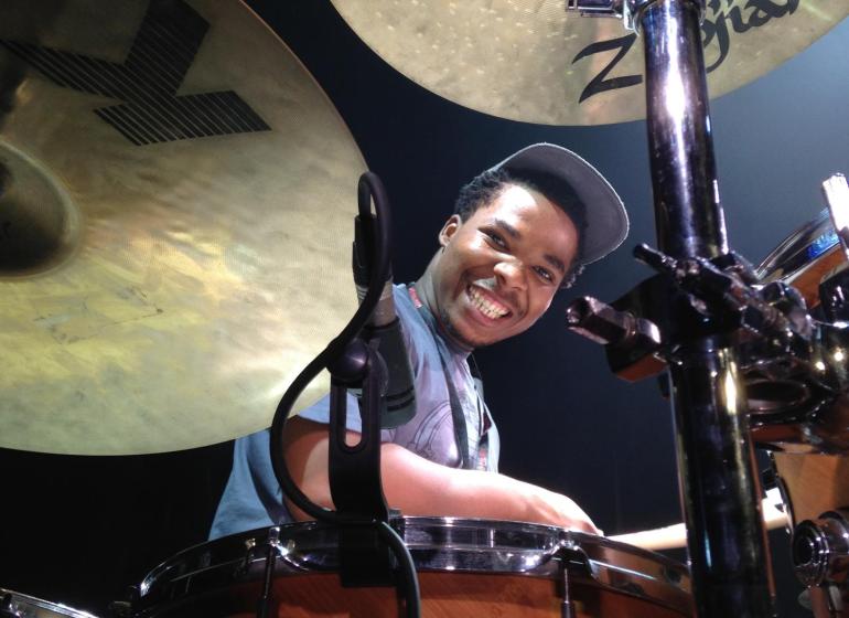 Lumanyano Mzi behind a drum kit