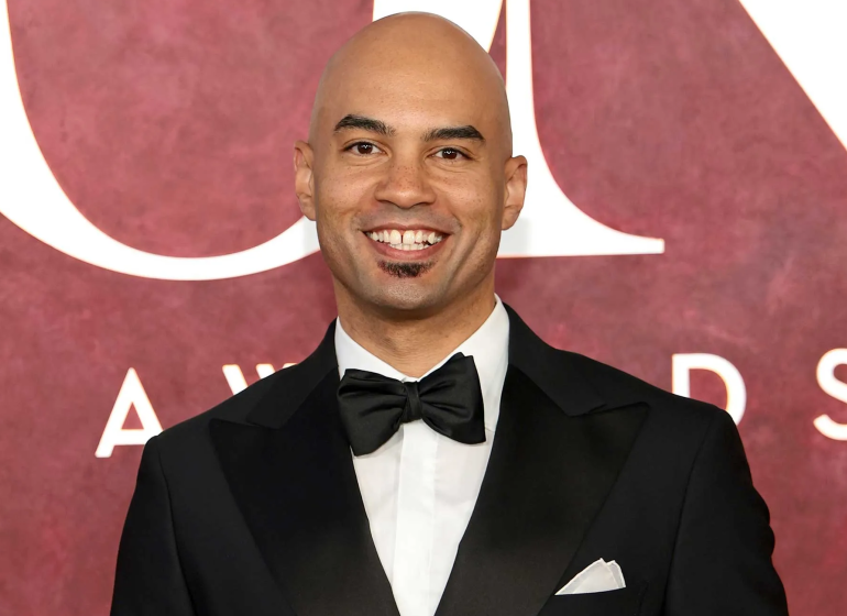 Photo of Nicholas Christopger in a tux on the Tony's red carpet