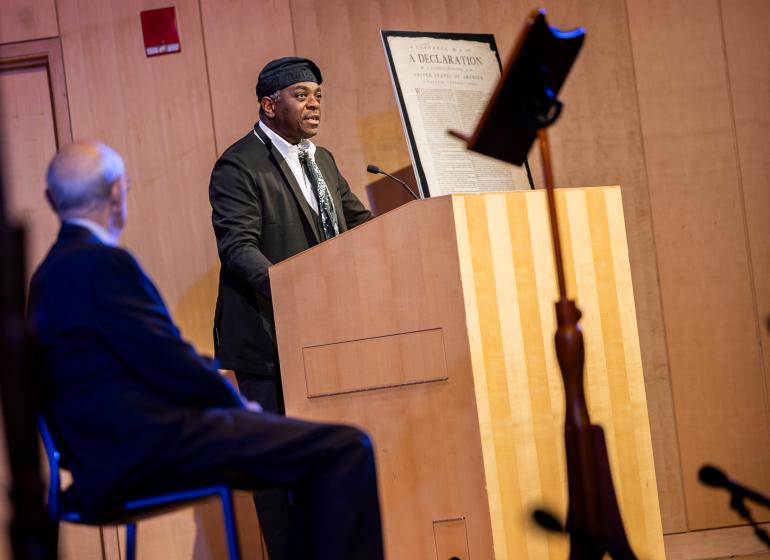 Regie Gibson, assistant professor and inaugural Massachusetts poet laureate, with US Supreme Court Justice Stephen Breyer (left) at We Hold These Truths on June 25, 2026.