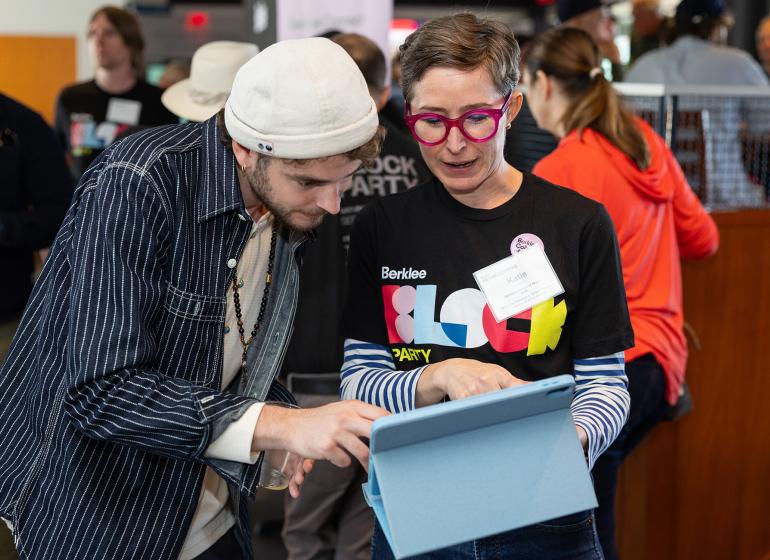 Katie Vitolins, vice president of alumni services and Berklee Connect, introduces Conor Heaney BM ’23 to the new platform at Berklee’s Homecoming Alumni Brunch.