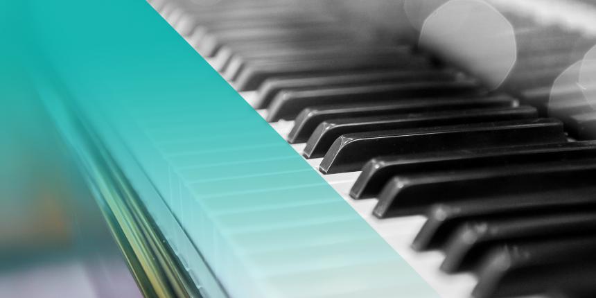 Black and white photo of a piano with a blue hue on the left