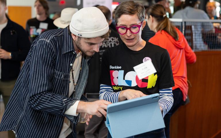 Katie Vitolins, vice president of alumni services and Berklee Connect, introduces Conor Heaney BM ’23 to the new platform at Berklee’s Homecoming Alumni Brunch.