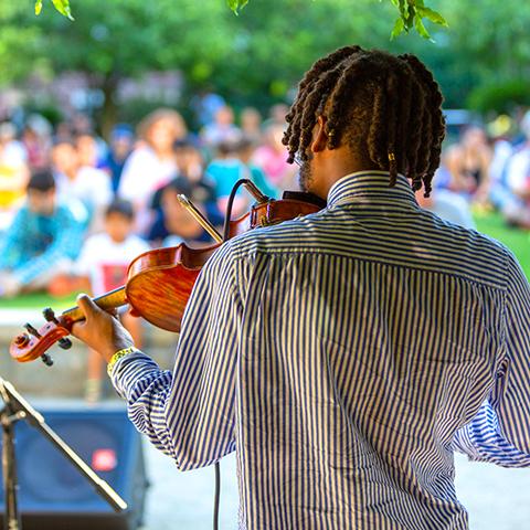 Student performing in front of a crowd
