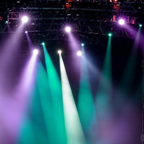 colorful stage lights shine down on the stage