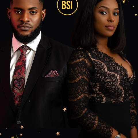 A black man in a suit and black woman in a gold/black dress stand back to back gazing out at the viewer. The BSI logo (a circle around the letters BSI) is between them in Gold.