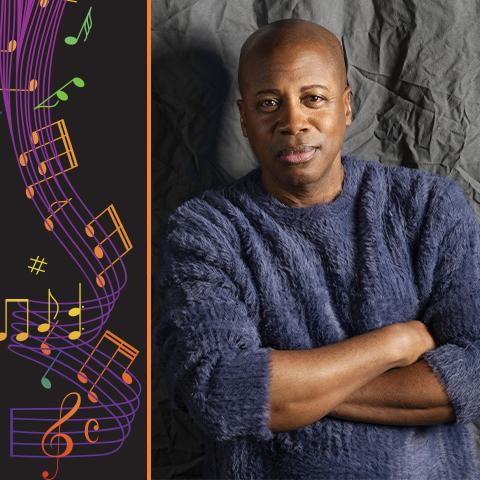 Pianist Terrence Wilson smiles in front of a gray background