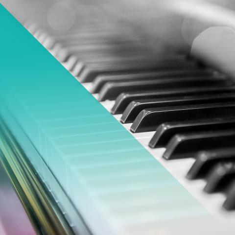 Black and white photo of a piano with a blue hue on the left