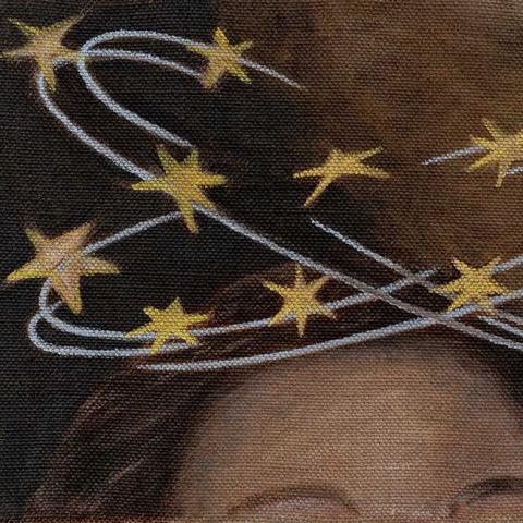 Image of a woman's head with yellow stars above her head