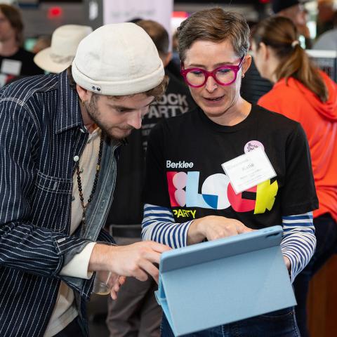 Katie Vitolins, vice president of alumni services and Berklee Connect, introduces Conor Heaney BM ’23 to the new platform at Berklee’s Homecoming Alumni Brunch.