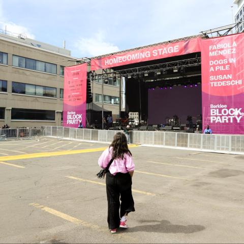 Berklee Homecoming Block Party stage with one person in the center of the frame back turned