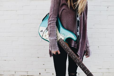 Girl holding a guitar
