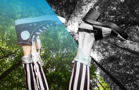 Two feet are up in the air, one wearing a high-top sneaker and the other wearing a strapped sandal