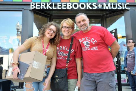 family standing in front of the Berklee Bookstore