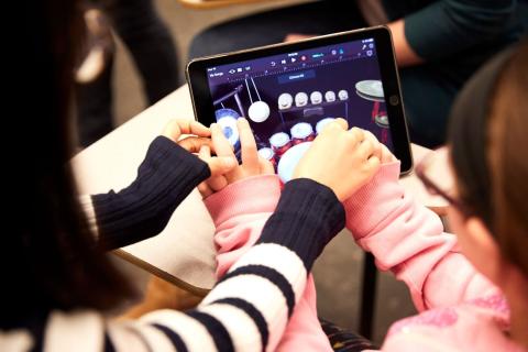 Students use a music therapy app 