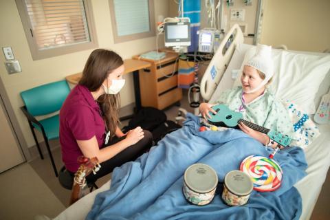 Child receiving music therapy from Berklee clinical expert through partnership with Ukulele Kids Club