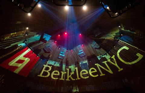 Berklee NYC recording studio illuminated with colorful lights and projections