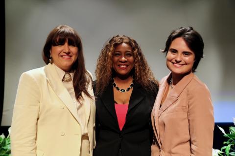 From left, Andreea Gleeson, Tonya Butler, and Hayley Roets pose for a picture on stage 