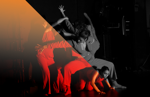 Four dancers on stage; one on the floor, one in a squat position, and two with arms intertwined.