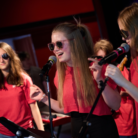 Students performing on stage