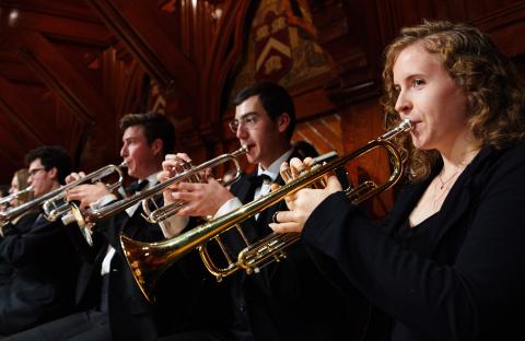 four trumpet players up close in concert black at Sanders Theatre