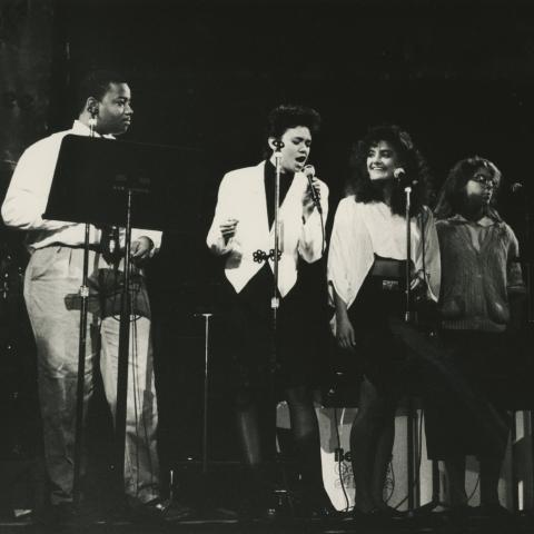 Students singing on stage during 1989 summer program