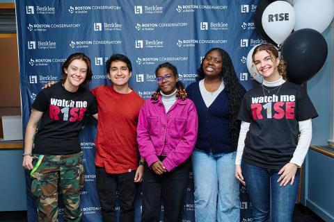 Students smiling at an event