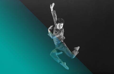 Image of a dancer leaping in air with a teal and black hue