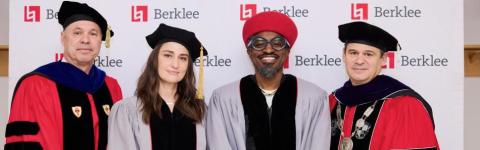 David Bogen, Sara Bareilles, Andre 3000, and Jim Lucchese pose together in academic regalia at commencement