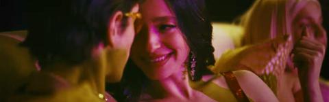 Two characters from the film 'Anora' looking lovingly at each other