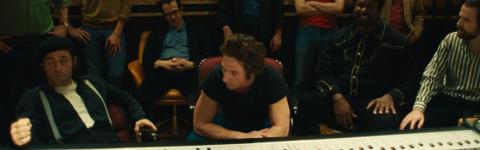 A still from the film 'Springsteen: Deliver Me from Nowhere' featuring the cast members behind a mixing board