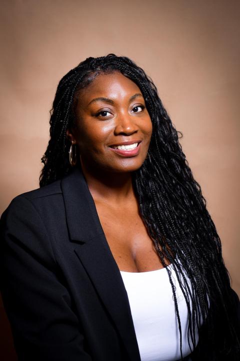 Woman with long Black hair in a top and blazer