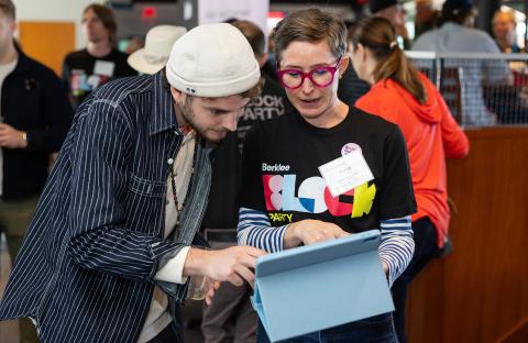 Katie Vitolins, vice president of alumni services and Berklee Connect, introduces Conor Heaney BM ’23 to the new platform at Berklee’s Homecoming Alumni Brunch.