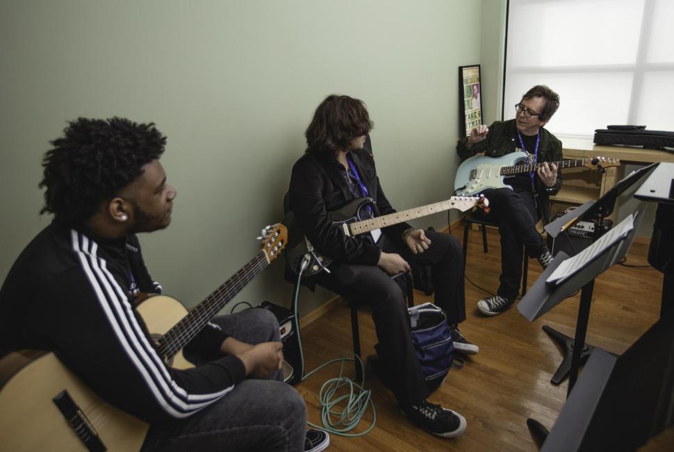 Students attend guitar masterclass at 2018 Berklee City Music Summit.
